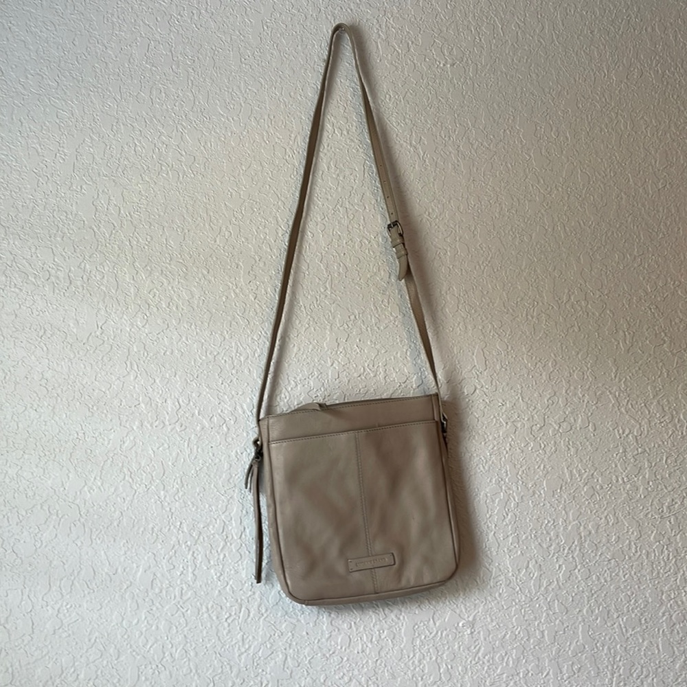 Lucky Brand cross-body bag with adjustable strap.
